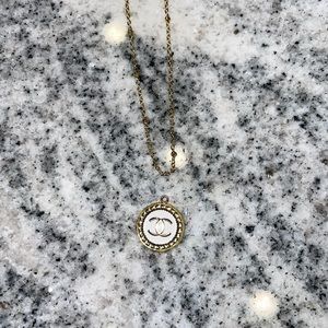 Gold Chanel button necklace